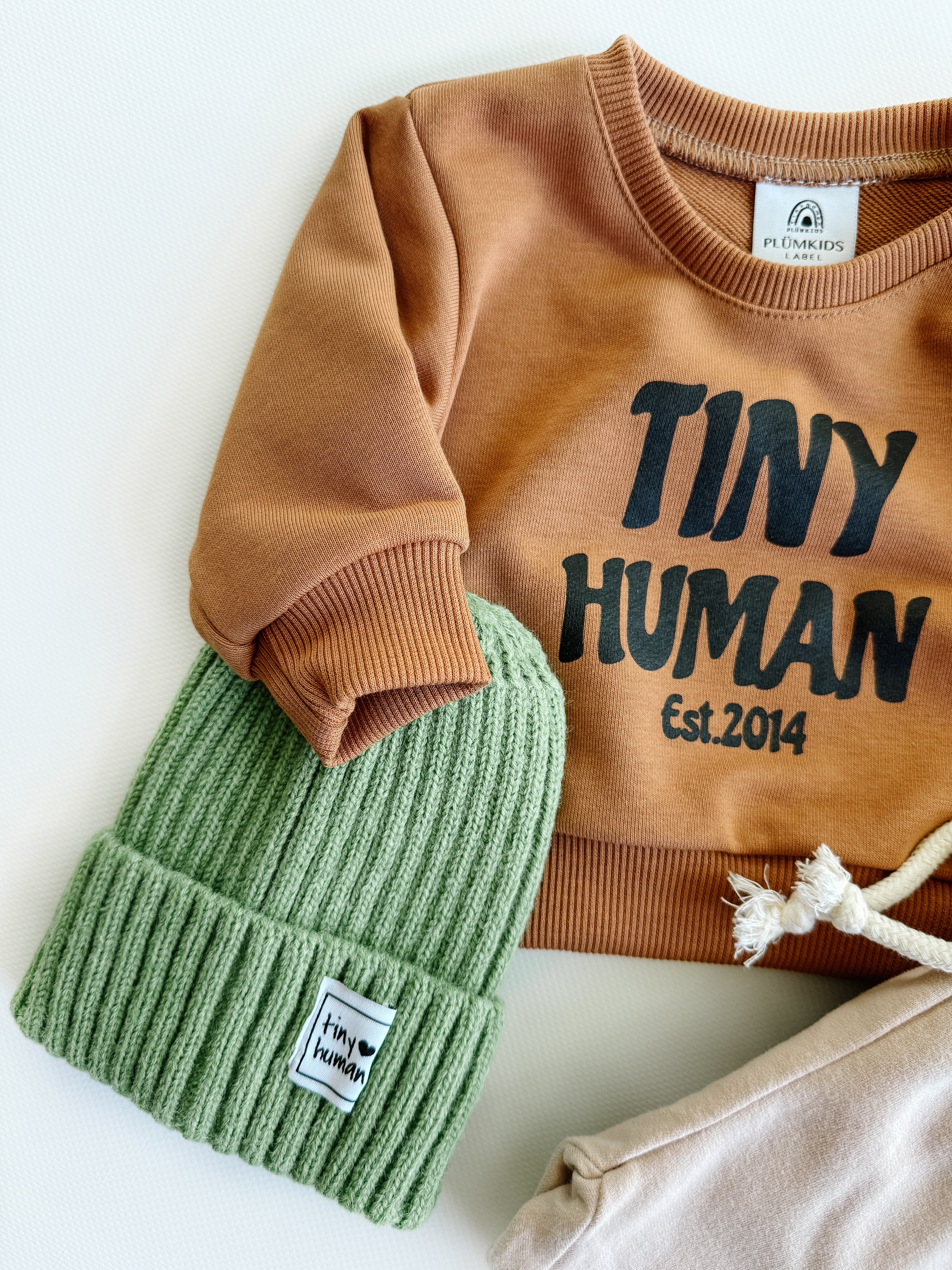 tiny human est.2014 | mocha