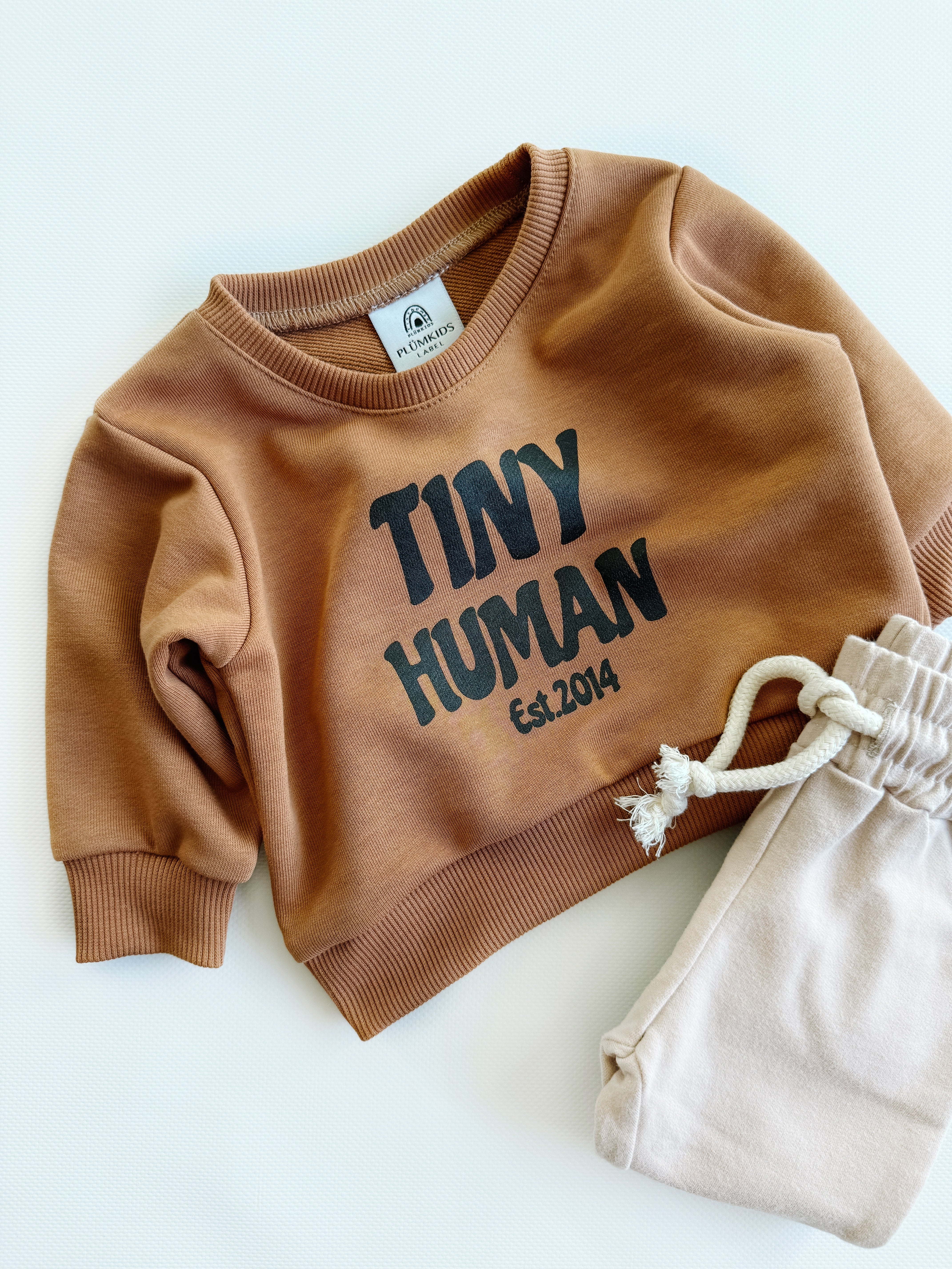 tiny human est.2014 | mocha